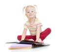 Funny smiling child in eyeglases reading book