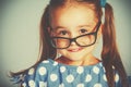 Funny smiling child girl in glasses Royalty Free Stock Photo