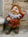 Funny smiling garden gnome with red jacket. Not copyrighted.