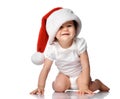 Funny smiling little baby girl child in Santa hat Royalty Free Stock Photo