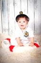 Funny smiling little boy dressed as a sea captain in naval cap.