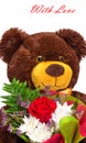 Funny smiling teddy bear with a bouquet of flowers