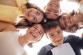 Funny smiling teenagers standing and looking down at camera. Group of cheerful friends in casual clothes having fun together Royalty Free Stock Photo