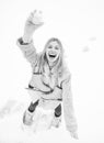 Funny smiling young woman in wintertime outdoor. Wearing funny hat plaid scarf and coat. Happy winter fun woman. Winter Royalty Free Stock Photo