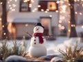 a funny snowman wearing hat and scarf standing in the backyard of the idyllic house. Royalty Free Stock Photo