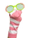 Funny sock puppet with sunglasses isolated on white