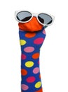 Funny sock puppet with sunglasses isolated on white