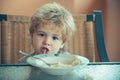 Funny spaghetti. The child eats spaghetti. Italian food for children. Cute boy at lunch.