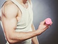 Funny sporty fit man lifting light dumbbell. Fun. Royalty Free Stock Photo