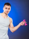 Funny sporty fit man lifting light dumbbell. Fun. Royalty Free Stock Photo