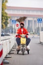 Funny street sweeper on a small electric tricycle, Beijing, China