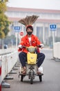 Funny street sweeper on a small electric tricycle, Beijing, China