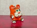 Funny striped orange kitten. Clay figurine with your own hand. Blurred focus