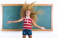 Funny student girl flipping long hair at school