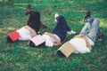 Funny students sleeping with books on their face