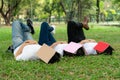 Funny students sleeping with books on their face.