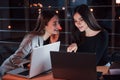 Funny stuff. Team of young business people works on their project at night time in the office Royalty Free Stock Photo