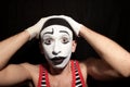 Funny stupid mime grabbed his head