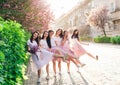 Funny stylsh girls in fashion lilac dresses celebrating bachelorette party