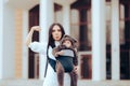 Strong Mom Walking her Cute Infant in Baby Carrier