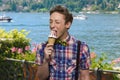 Funny teen boy enjoying tasty ice-cream.