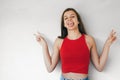 Funny teen girl making victory sign sticking out her tongue Royalty Free Stock Photo