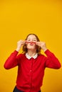 Funny teen school girl make mustache on her face with red pencil, Royalty Free Stock Photo