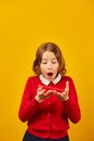 Funny teen school girl make mustache on her face with red pencil, Royalty Free Stock Photo