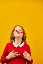 Funny teen school girl make mustache on her face with red pencil, Royalty Free Stock Photo