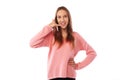 Funny teenager imitating a phone call conversation while posing