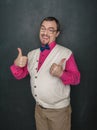 Funny thick teacher or business man showing thumbs up on blackboard Royalty Free Stock Photo