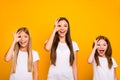 Funny three sister ladies holding hands in okey symbols near eye like specs wear casual outfit isolated yellow Royalty Free Stock Photo