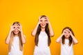 Funny three sister ladies holding hands in okey symbols near eyes like specs wear casual outfit isolated yellow Royalty Free Stock Photo