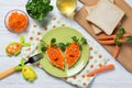 Funny toasts in a shape of carrots, food for kids Easter idea, top view