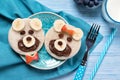 Funny toasts in a shape of teddy bears, food for kids idea, top view
