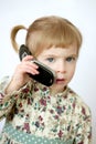 Funny toddler girl talking mobile cell phone