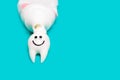 Cute tooth character enjoys cleaning