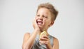 Funny toothless boy with sensitive teeth holding ice cream Royalty Free Stock Photo