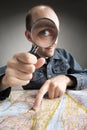 Funny tourist discovering map Royalty Free Stock Photo