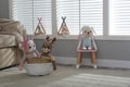 Funny toy unicorn, dog and deer in children`s room. Interior design