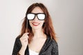 Funny trendy fashion girl with paper glasses playing with emotion Royalty Free Stock Photo