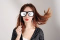 Funny trendy fashion girl with paper glasses playing with emotion Royalty Free Stock Photo