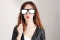 Funny trendy fashion girl with paper glasses playing with emotion Royalty Free Stock Photo