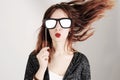 Funny trendy fashion girl with paper glasses playing with emotion Royalty Free Stock Photo