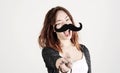 Funny trendy fashion girl with paper mustache playing with emotion Royalty Free Stock Photo