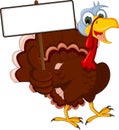 Funny turkey cartoon posing with blank sign