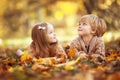 Funny twins in autumn park Royalty Free Stock Photo