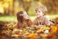 Funny twins in autumn park Royalty Free Stock Photo