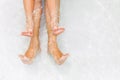 Funny underwater photo of bare feet in swimming pool Royalty Free Stock Photo