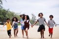 Funny vacation. Children or kids playing and romp together at the beach on holiday. Having fun after unlocking down the city from Royalty Free Stock Photo